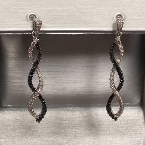 1/2 cttw  black and white diamond swirl earrings.